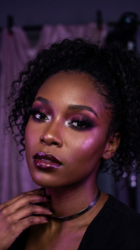 deep plum smoky eye makeup Black woman berry aubergine silver inner corner dark skin moody editorial