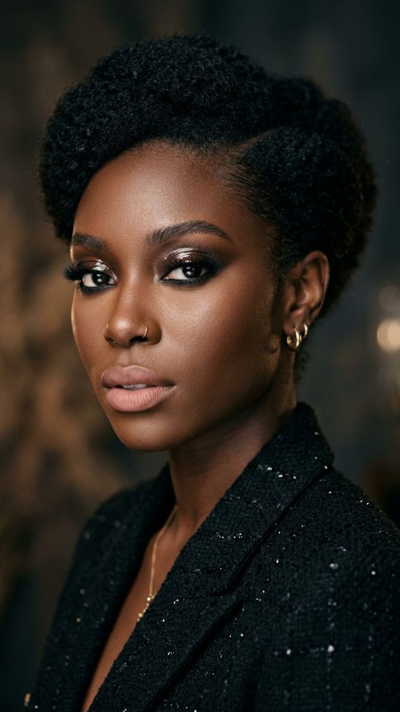 glossy lid smoky eye makeup Black woman wet look deep brown base full lashes dark skin editorial modern