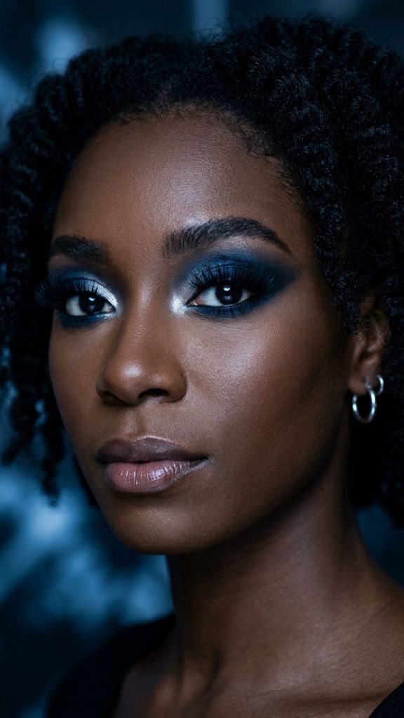midnight blue navy smoky eye makeup Black woman silver inner corner dark skin dramatic moody editorial