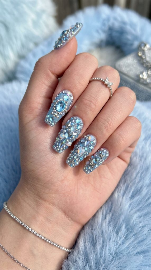 Y2K rhinestone nails covered in sparkling gems
