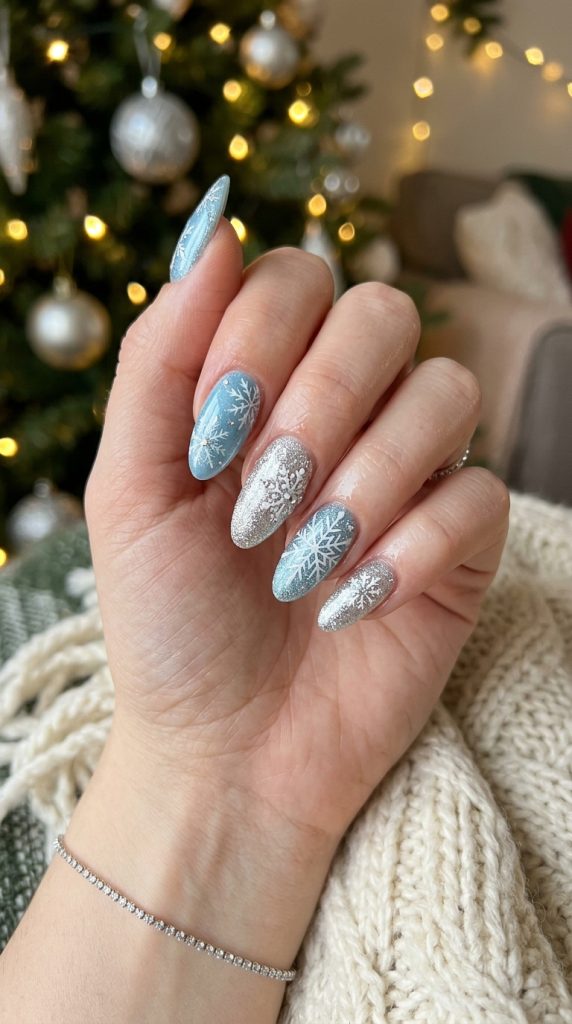  Icy blue winter fingernail design with white snowflakes
