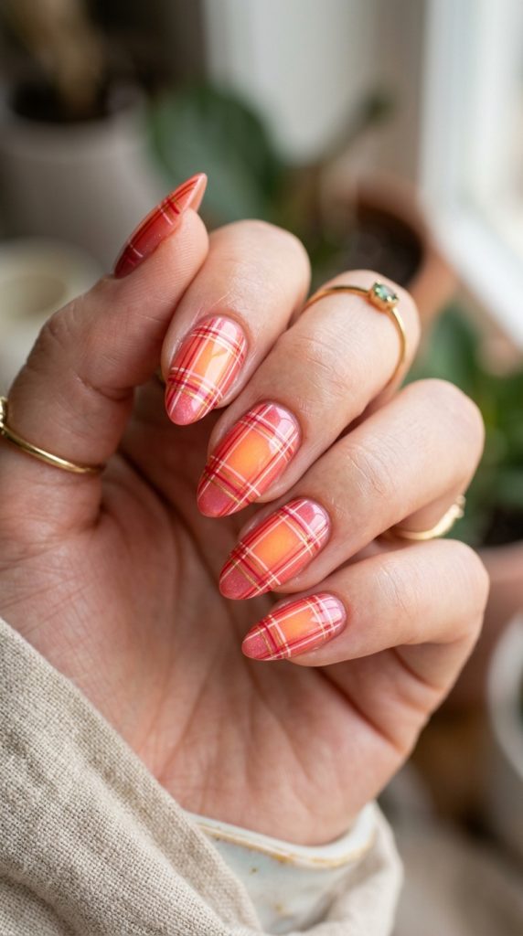 Peachy coral aura nails with a warm sun-kissed glow