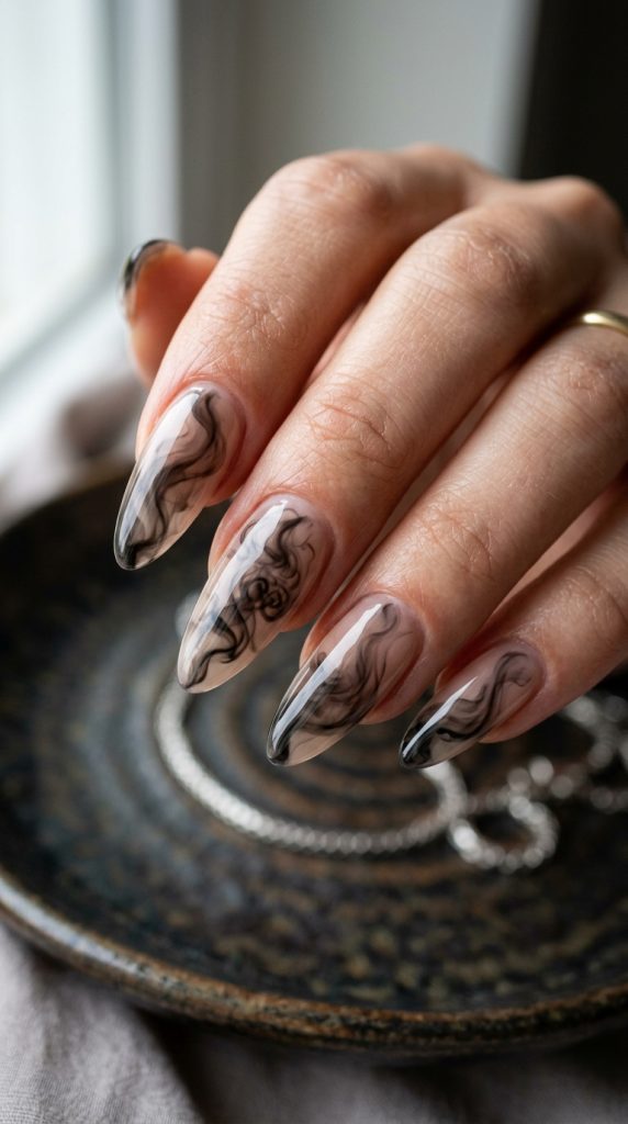 Black smoke aura nails with a smoky glow over sheer