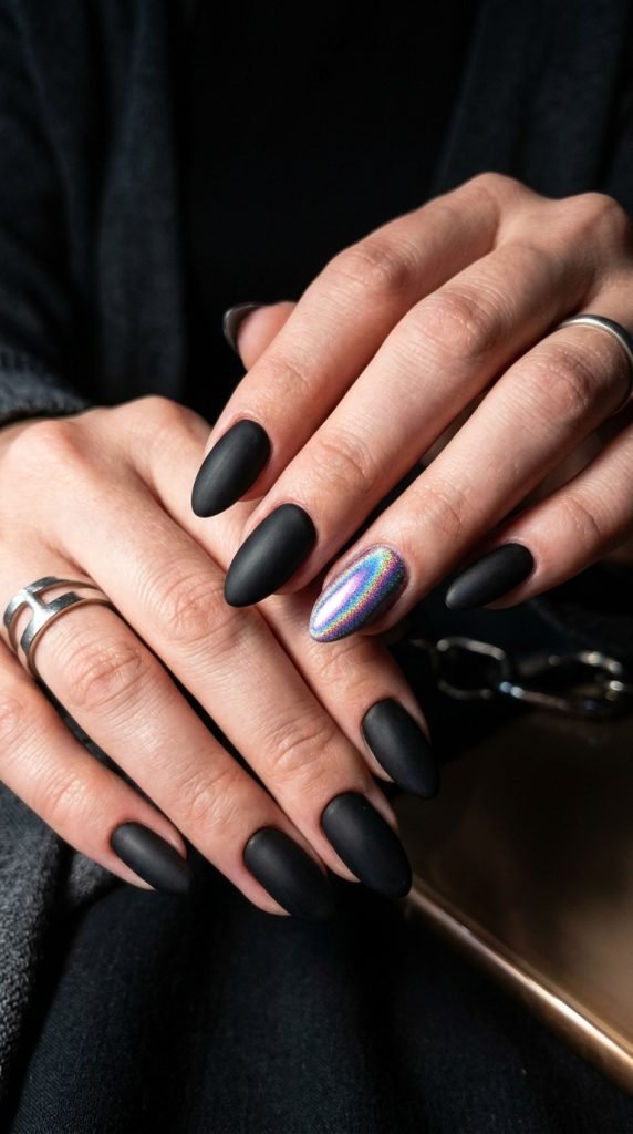 Matte black gel nail with holographic chrome accent nail