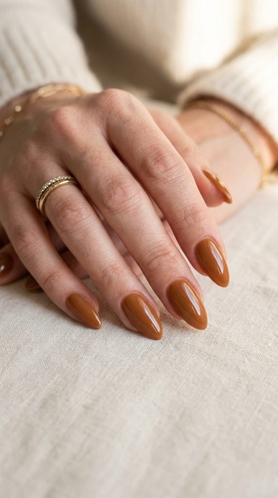 Rich caramel brown nails with glossy sophisticated finish