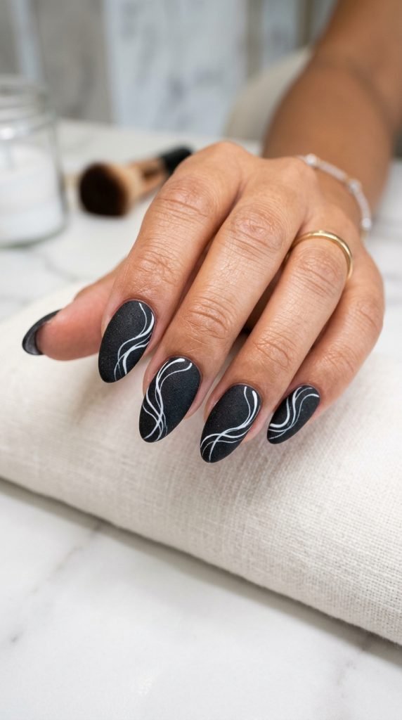 Matte black dip nails showing sophisticated non-shine finish