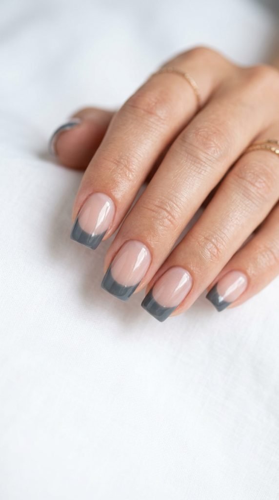 Graphite gray dip nails showing sophisticated neutral tone and modern finish