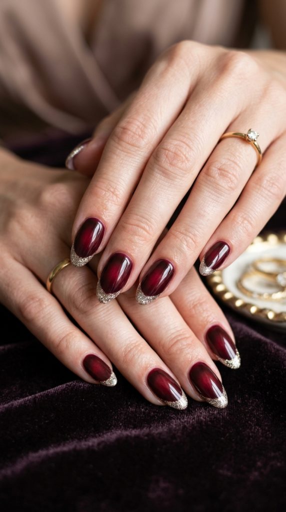  Deep wine aura nails with a rich moody glow
