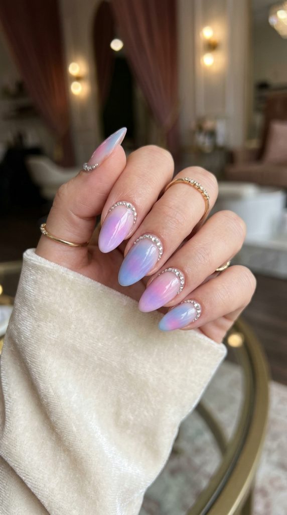Rhinestone aura nails with gems near the cuticle