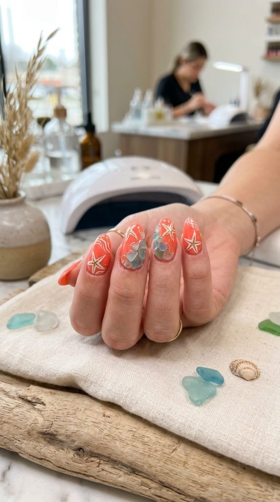 Starfish and sea glass nail art showing colorful coastal beach-inspired design