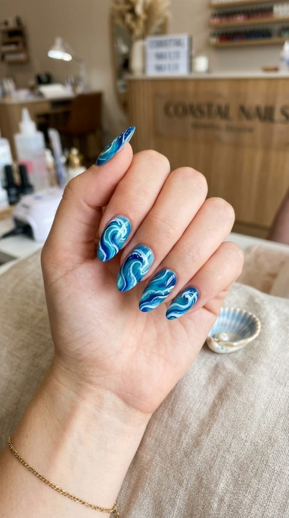Wave swirl abstract nails showing artistic water movement-inspired design